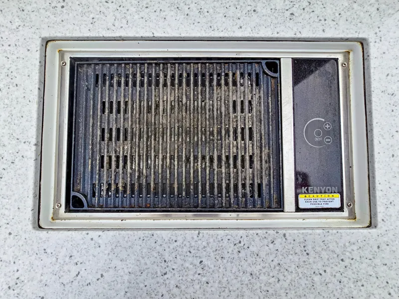 Slide: The Image of Built-in Kenyon grill on 2020 Aquila 36 Sport boat deck. - 32