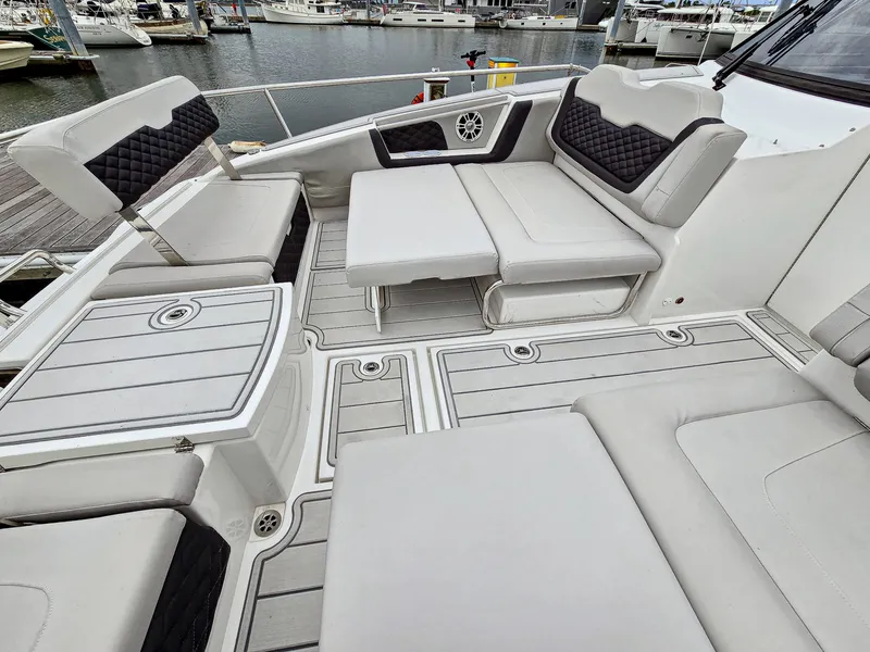 Slide: The Image of Aquila 36 Sport 2020 boat with spacious seating and modern design at a marina. - 41