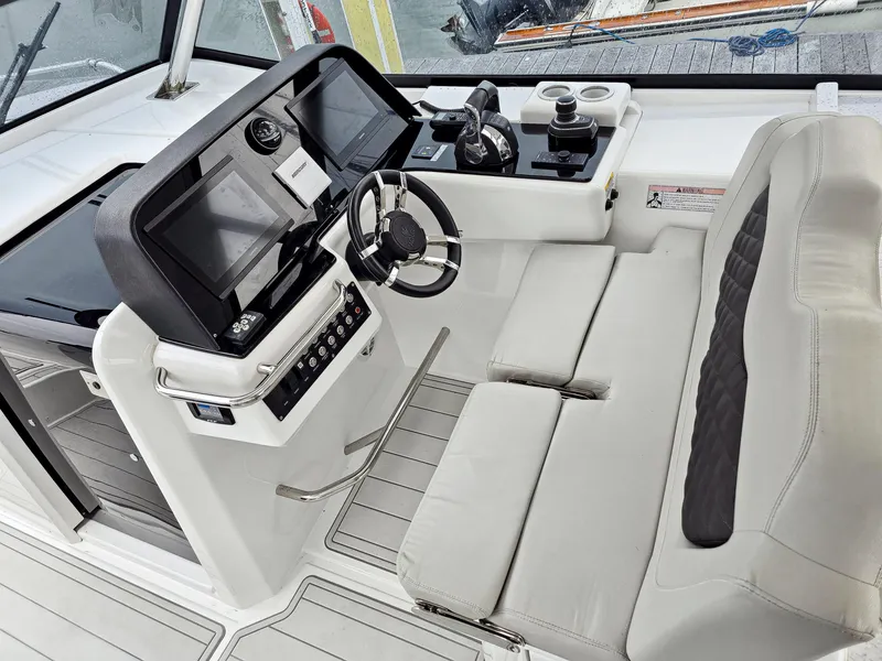 Slide: The Image of Interior cockpit of 2020 Aquila 36 Sport boat with modern controls and seating. - 5