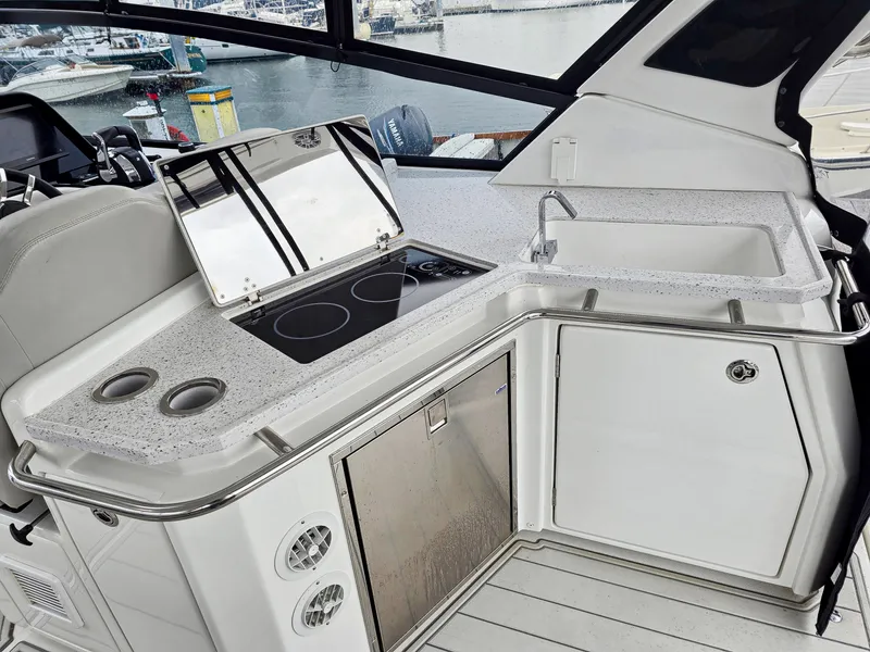 Slide: The Image of Aquila 36 Sport 2020 yacht kitchen with stove, sink, and storage. - 7