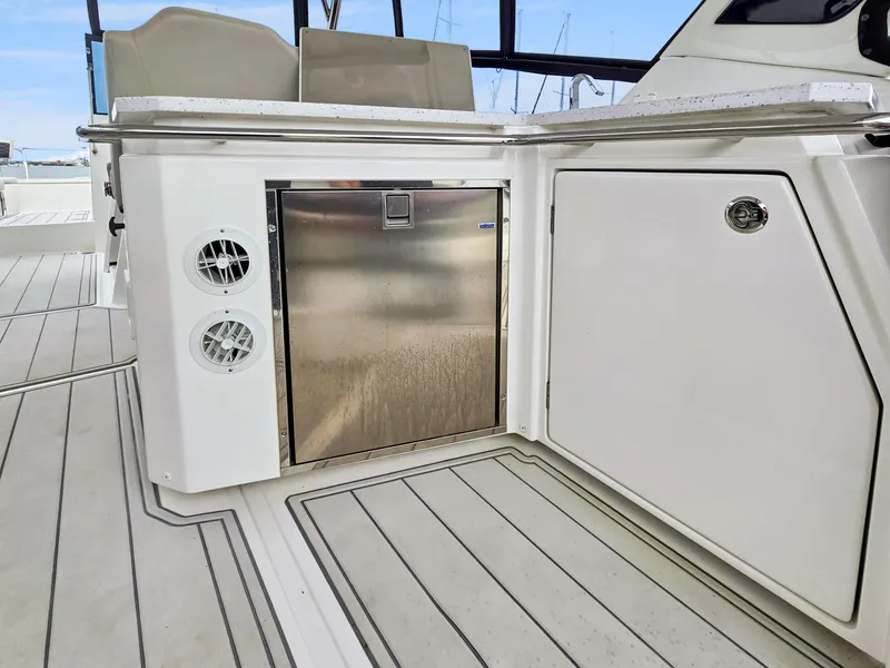 Slide: The Image of Aquila 36 Sport 2020 yacht interior with stainless steel fridge and sleek cabinetry. - 8