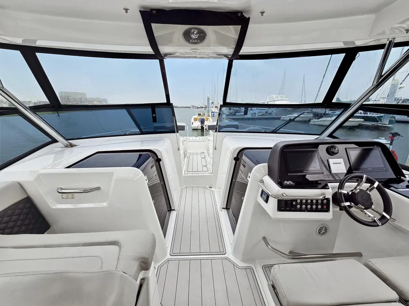 Slide: The Image of Interior view of 2020 Aquila 36 Sport yacht cockpit with modern controls and seating. - 9