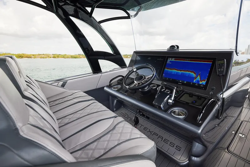 Slide: The Image of 2023 Midnight Express 37' Open boat interior with advanced navigation system and luxurious seating. - 13
