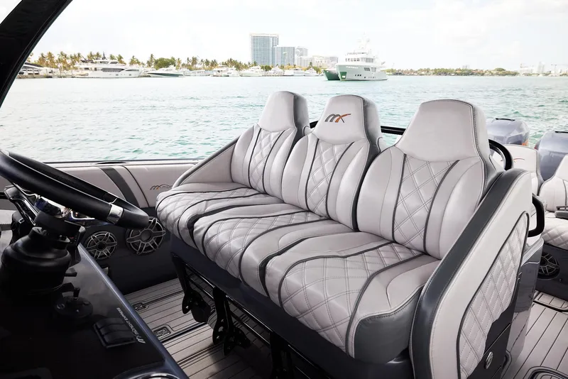 Slide: The Image of 2023 Midnight Express 37' Open boat interior with luxurious seating and waterfront view. - 14