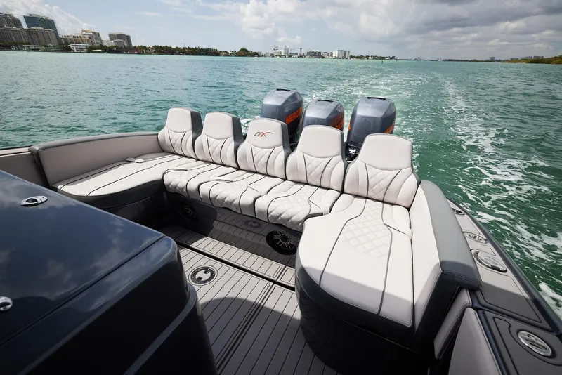 Slide: The Image of 2023 Midnight Express 37' Open boat with luxurious seating on open water. - 18