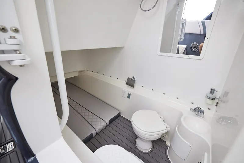 Slide: The Image of 2023 Midnight Express 37' Open boat interior with bed and toilet. - 19