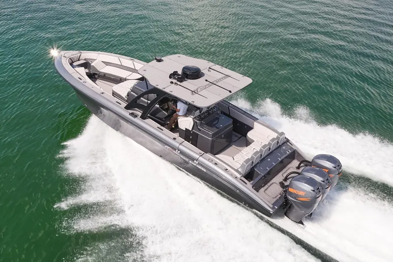 Slide: The Image of 2023 Midnight Express 37' Open boat cruising on water, showcasing sleek design and powerful engines. - 3