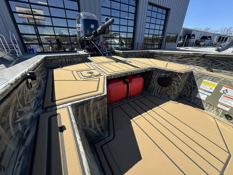 Slide: The Image of 2025 Tracker Grizzly 1650 T Prairie Wings Edition boat interior with storage compartments. - 17