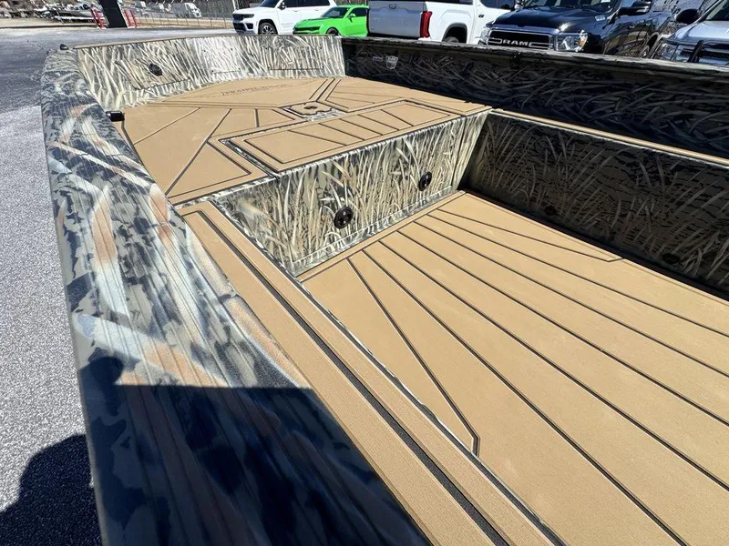 Slide: The Image of 2025 Tracker Grizzly 1650 T Prairie Wings Edition boat interior with camouflage design. - 18