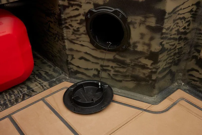 Slide: The Image of 2025 Tracker Grizzly 1650 T Prairie Wings Edition interior with open hatch and camouflage design. - 28