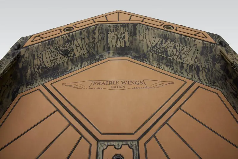 Slide: The Image of 2025 Tracker Grizzly 1650 T Prairie Wings Edition boat interior with camouflage design. - 32