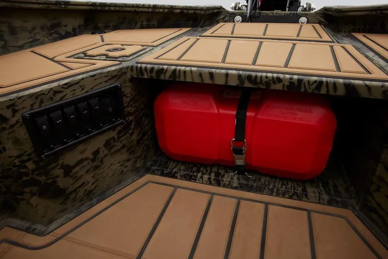 Slide: The Image of 2025 Tracker Grizzly 1650 T Prairie Wings Edition interior with red fuel tank. - 37