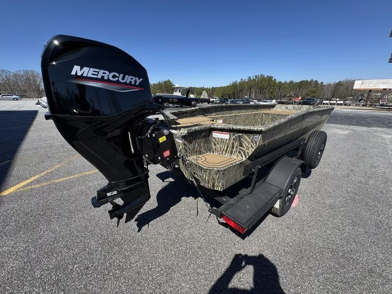 Slide: The Image of 2025 Tracker Grizzly 1650 T Prairie Wings Edition boat with Mercury engine on trailer. - 4