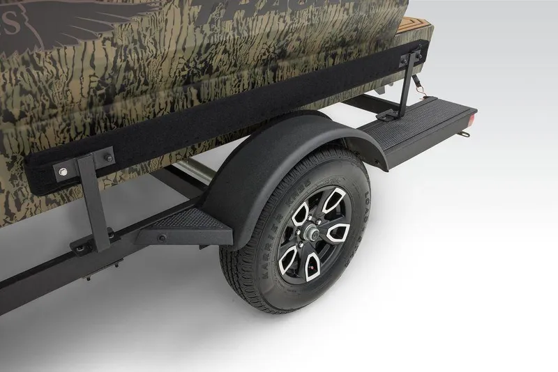Slide: The Image of 2025 Tracker Grizzly 1650 T Prairie Wings Edition trailer with camouflage design and black wheel. - 41