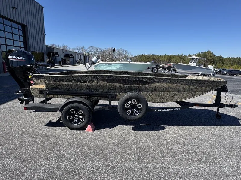Slide: The Image of 2025 Tracker Grizzly 1650 T Prairie Wings Edition boat on trailer, outdoors. - 5