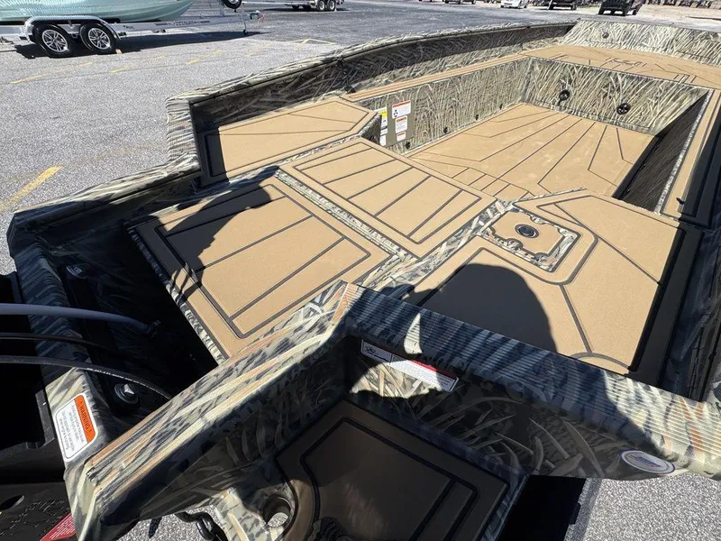 Slide: The Image of 2025 Tracker Grizzly 1650 T Prairie Wings Edition boat interior with camouflage design. - 6