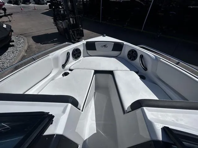 Slide: The Image of 2016 Monterey 196MS boat interior with white seating and speakers. - 11