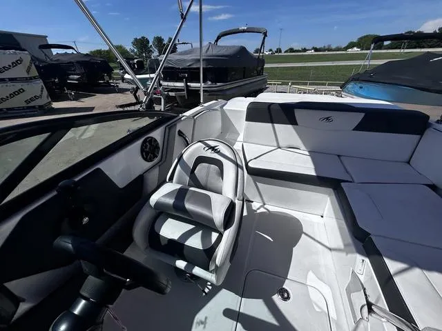 Slide: The Image of Interior of a 2016 Monterey 196MS boat with seating and steering wheel. - 13