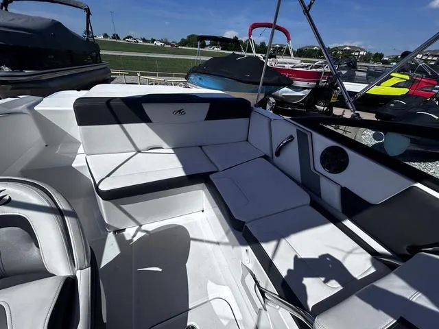 Slide: The Image of 2016 Monterey 196MS boat interior with white seating and modern design. - 14