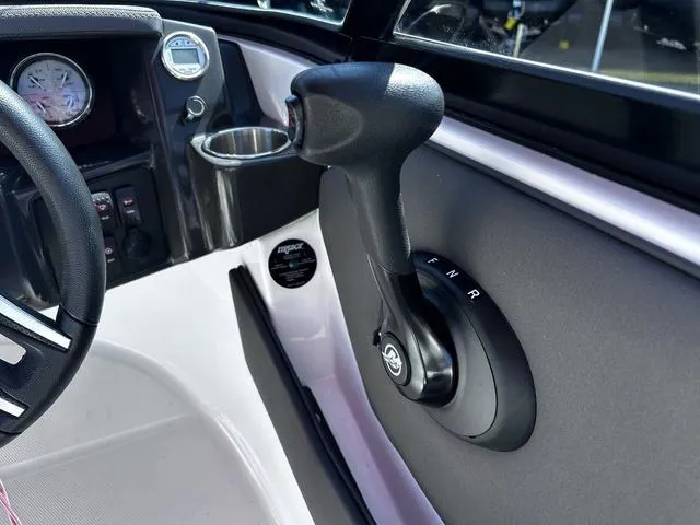 Slide: The Image of Interior of a 2016 Monterey 196MS boat showing steering and throttle controls. - 16