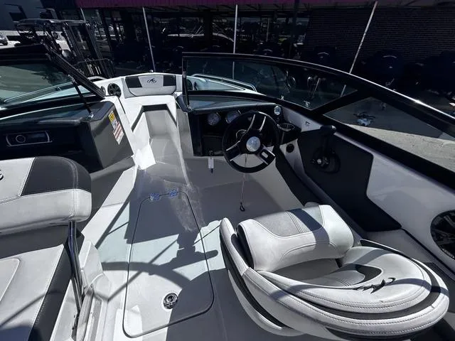 Slide: The Image of Interior of a 2016 Monterey 196MS boat with sleek seating and modern dashboard. - 9