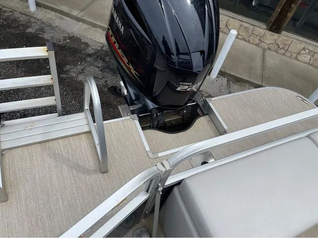 Slide: The Image of 2018 SunCatcher X324RS boat with Yamaha 225 engine, featuring beige deck and metal railings. - 10