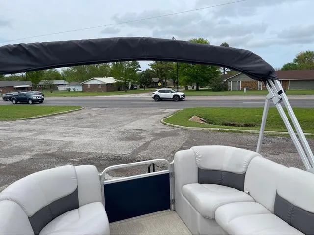 Slide: The Image of Pontoon boat SunCatcher X324RS (2018) parked near a suburban street. - 16