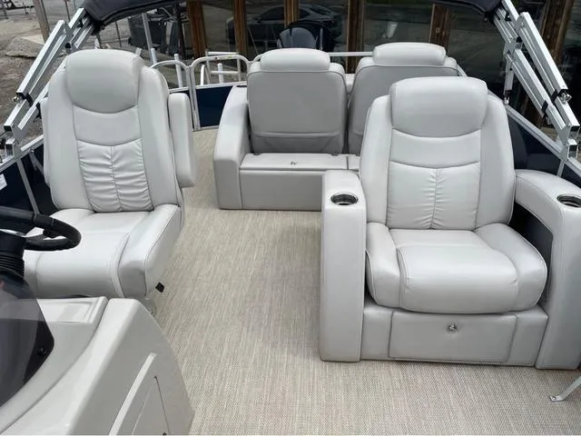 Slide: The Image of Luxurious seating on 2018 SunCatcher X324RS boat, featuring plush white leather upholstery. - 7