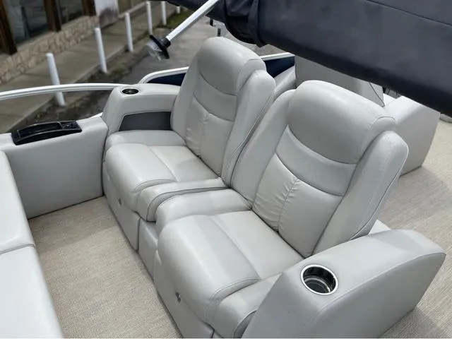 Slide: The Image of Luxurious seating on 2018 SunCatcher X324RS boat with cup holders and armrests. - 9