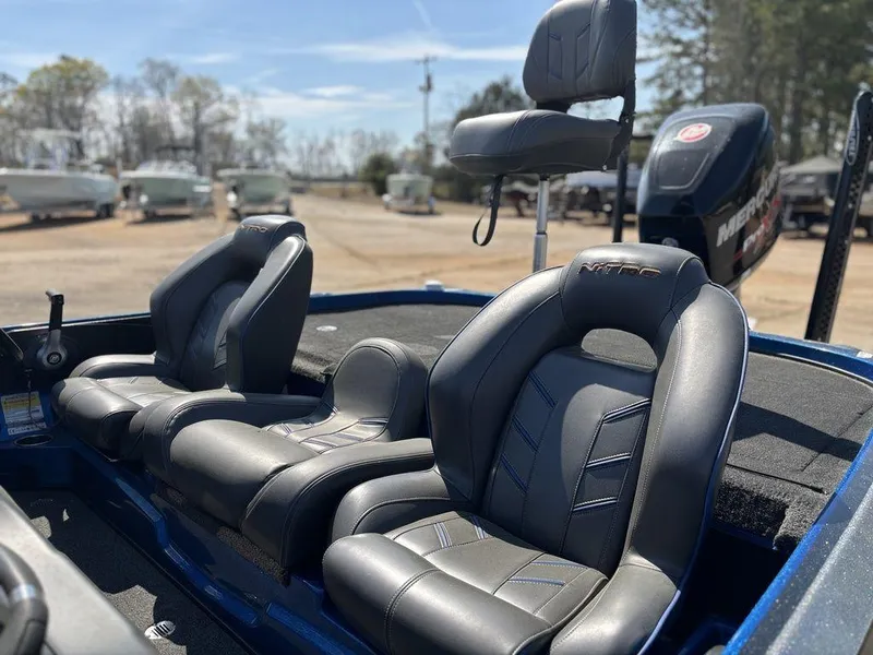 Slide: The Image of 2018 Nitro Z21 boat with leather seats and Mercury engine in a sunny outdoor setting. - 12
