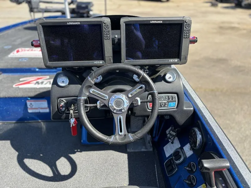 Slide: The Image of 2018 Nitro Z21 boat dashboard with dual Lowrance HDS12 displays and steering wheel. - 9