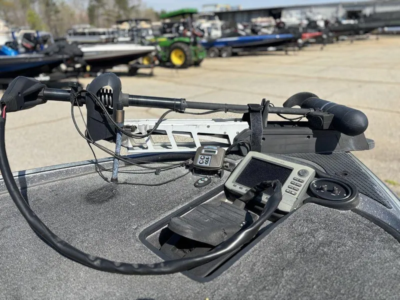 Slide: The Image of 2012 Triton 21 HP boat dashboard with navigation equipment and controls. - 13