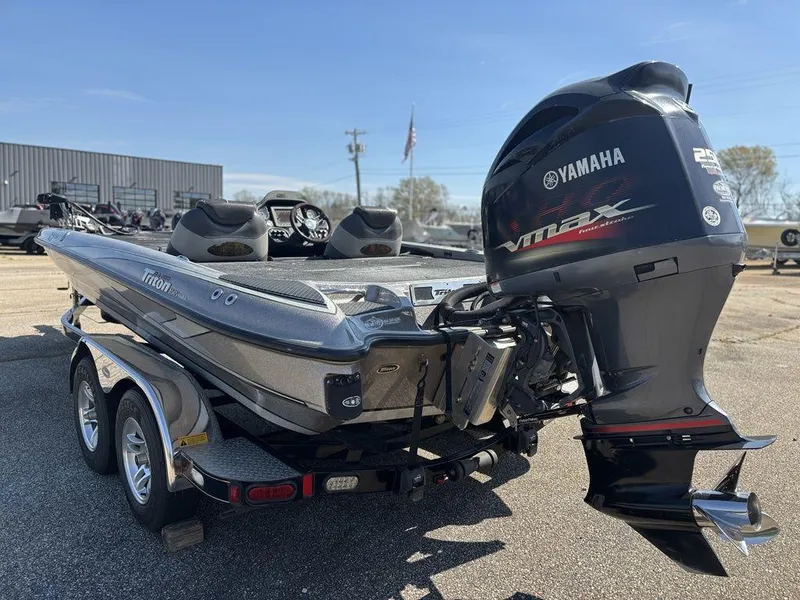 Slide: The Image of 2012 Triton 21 HP boat with Yamaha VMAX outboard motor on a trailer. - 4