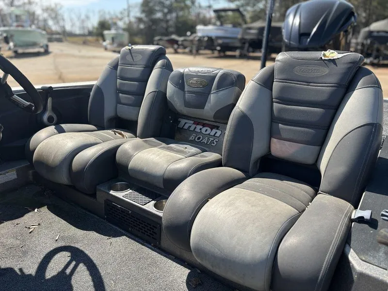 Slide: The Image of Luxurious seating in a 2012 Triton 21 HP boat, showcasing comfortable leather upholstery. - 9