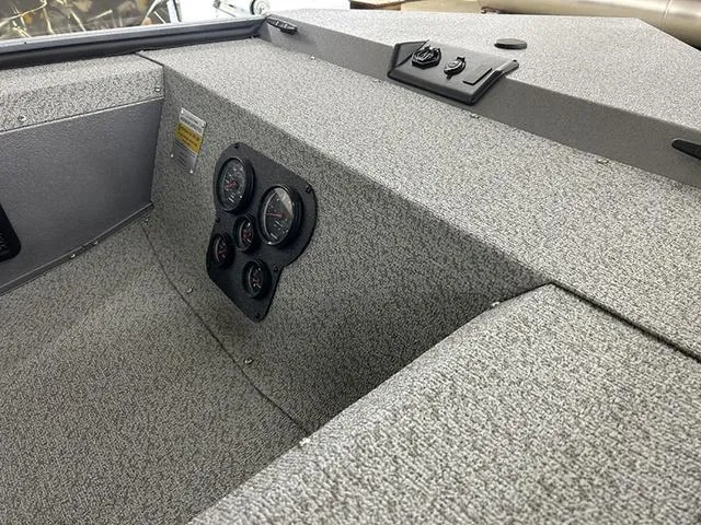 Slide: The Image of Interior of 2025 War Eagle 754VS boat with dashboard and gauges. - 3