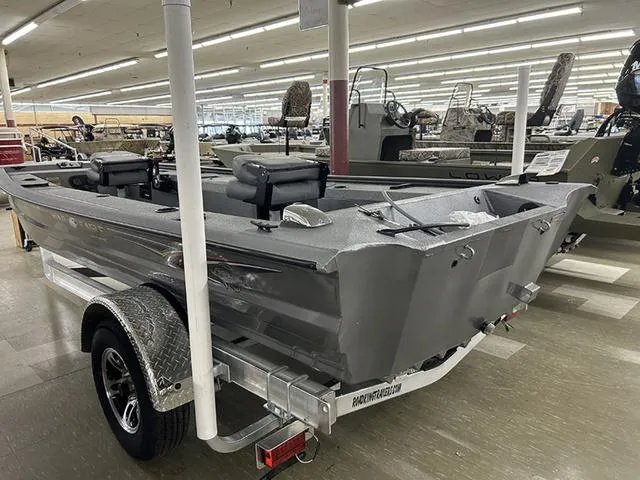 Slide: The Image of 2025 War Eagle 754VS boat on trailer in showroom, featuring dual seats and sleek design. - 7