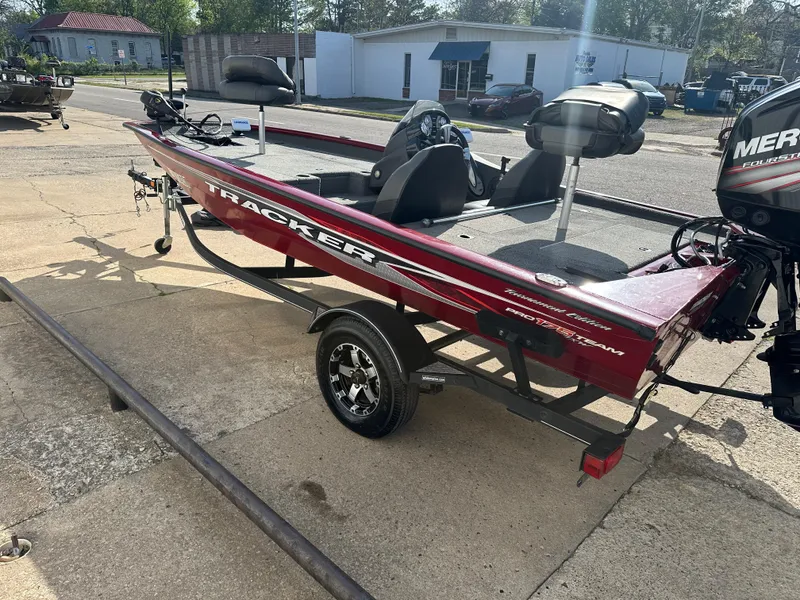Slide: The Image of 2019 Tracker Pro Team 175 TXW Tournament Edition boat on trailer, parked outdoors. - 10