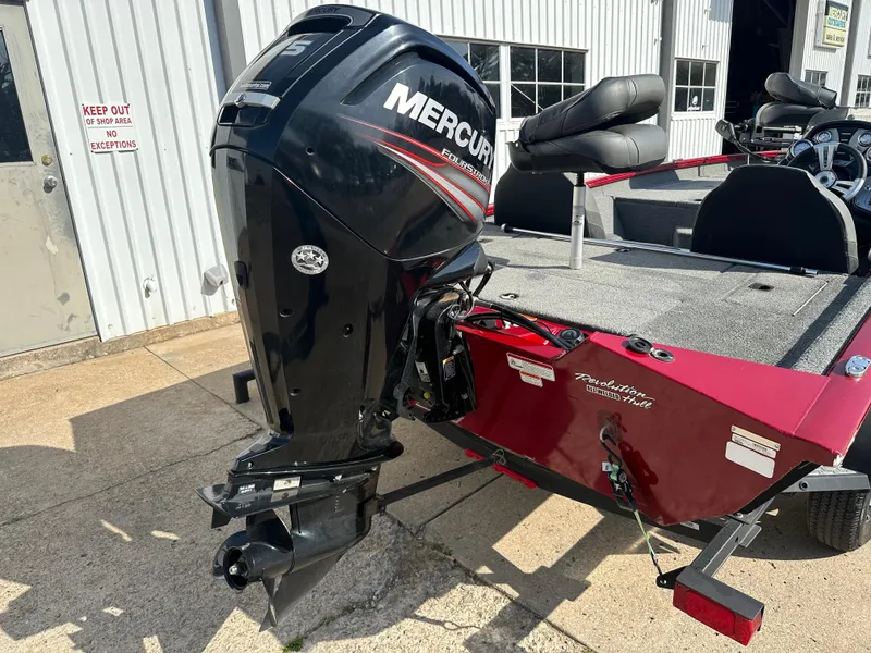 Slide: The Image of 2019 Tracker Pro Team 175 TXW Tournament Edition boat with Mercury engine, parked outdoors. - 11