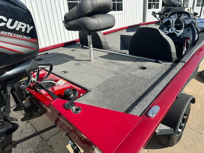 Slide: The Image of 2019 Tracker Pro Team 175 TXW Tournament Edition boat with Mercury engine, red and gray interior. - 12