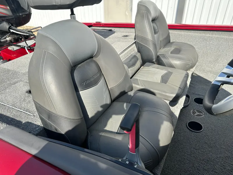 Slide: The Image of 2019 Tracker Pro Team 175 TXW Tournament Edition boat seats, gray upholstery, and steering wheel. - 13