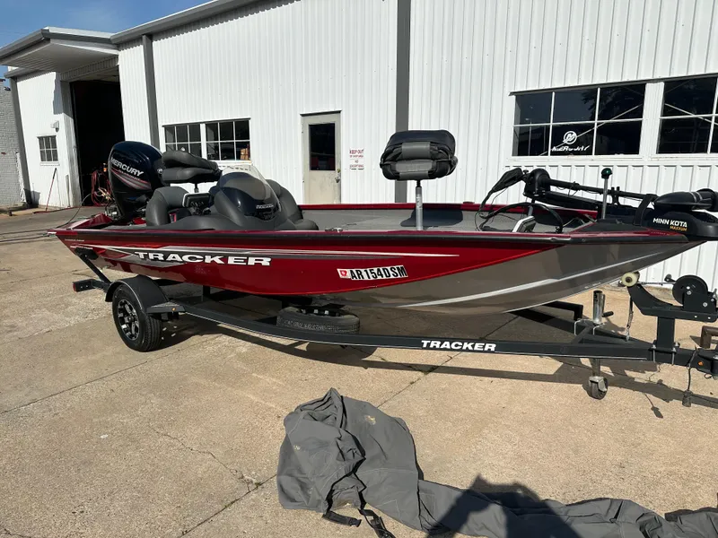 Slide: The Image of 2019 Tracker Pro Team 175 TXW Tournament Edition boat on trailer, parked outside a building. - 3