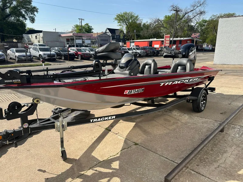 Slide: The Image of 2019 Tracker Pro Team 175 TXW Tournament Edition boat on trailer, parked outdoors. - 4