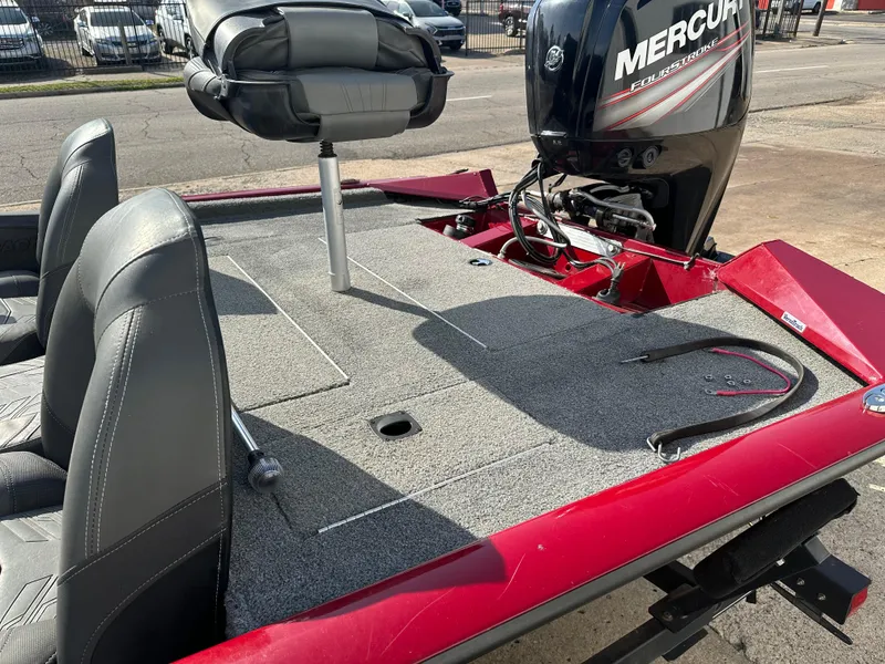 Slide: The Image of 2019 Tracker Pro Team 175 TXW Tournament Edition boat with Mercury engine, red and gray interior. - 8