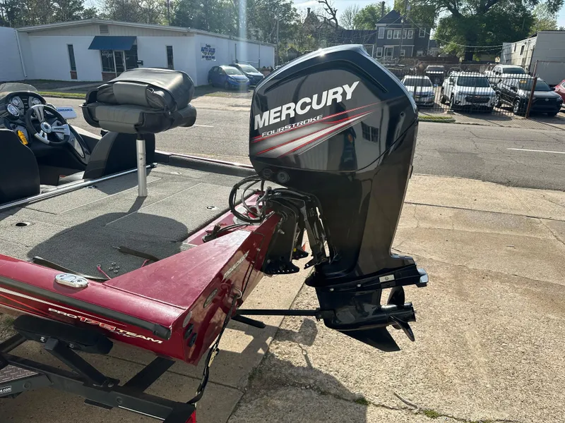 Slide: The Image of 2019 Tracker Pro Team 175 TXW Tournament Edition with Mercury outboard motor, parked outdoors. - 9