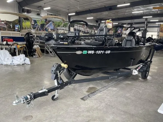 Slide: The Image of 2021 Lund 1650 Rebel XL SS boat on trailer in showroom. - 12