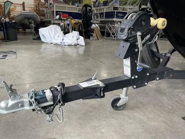 Slide: The Image of Trailer hitch of a 2021 Lund 1650 Rebel XL SS in a showroom setting. - 13