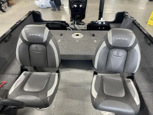 Slide: The Image of 2021 Lund 1650 Rebel XL SS boat interior with two gray seats. - 25