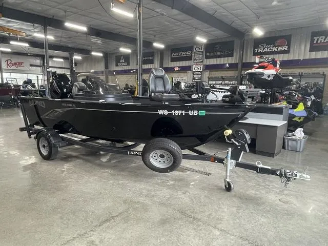 Slide: The Image of 2021 Lund 1650 Rebel XL SS boat on trailer in showroom. - 3