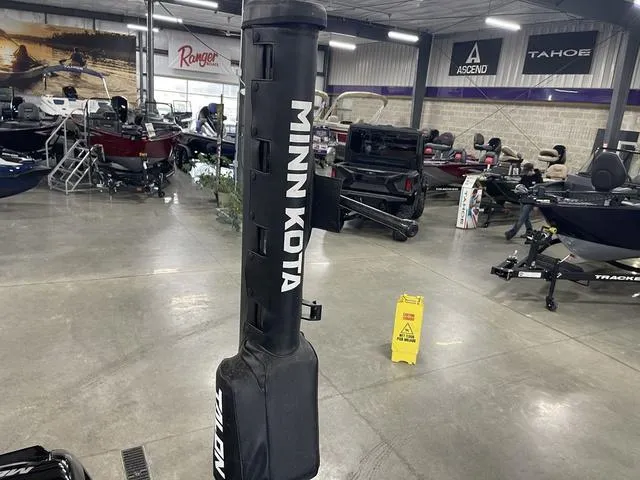 Slide: The Image of Minn Kota equipment in a showroom with Lund 1650 Rebel XL SS boats, 2021 model. - 30