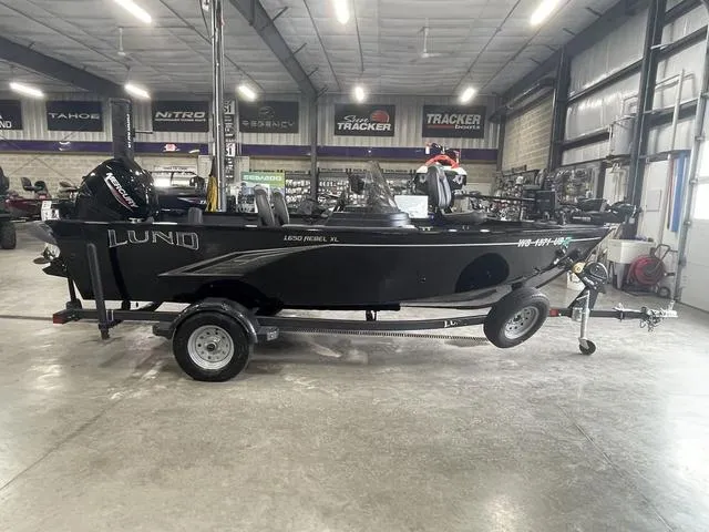 Slide: The Image of 2021 Lund 1650 Rebel XL SS boat on trailer in showroom. - 5